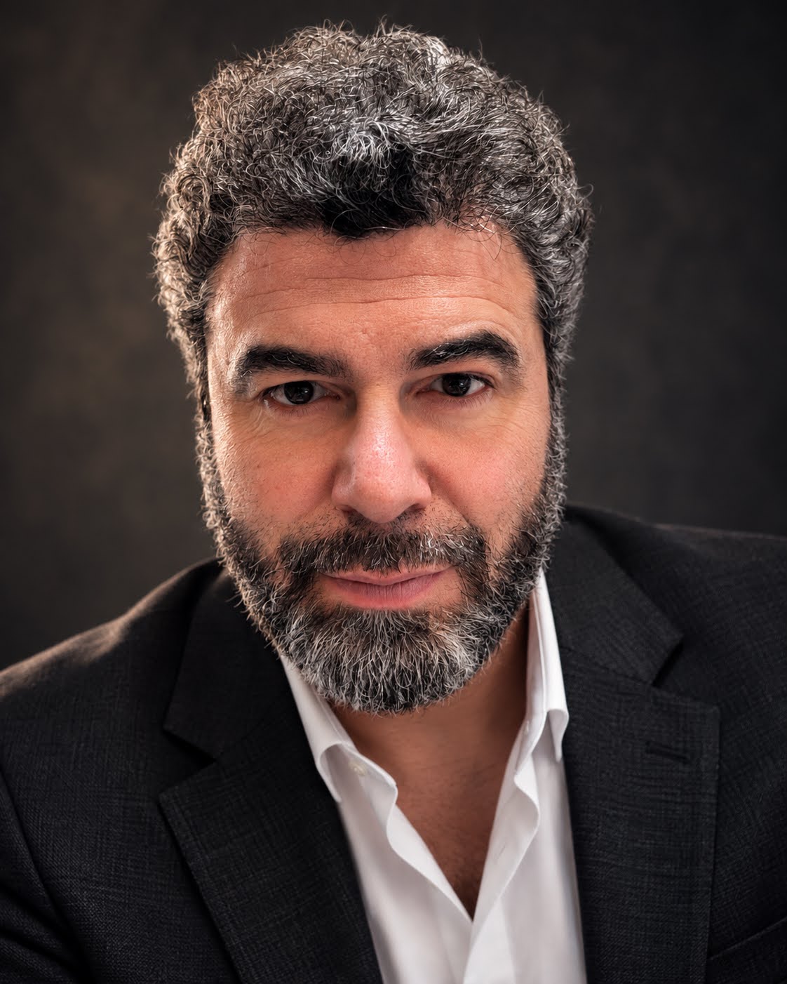 Yoni Ryabinski in a dark jacket and white shirt